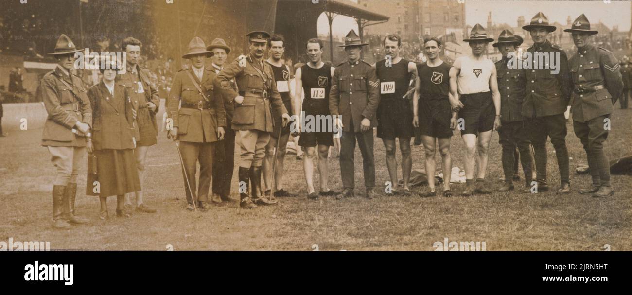 Untitled [Army personnel standing with runners]. From World War I