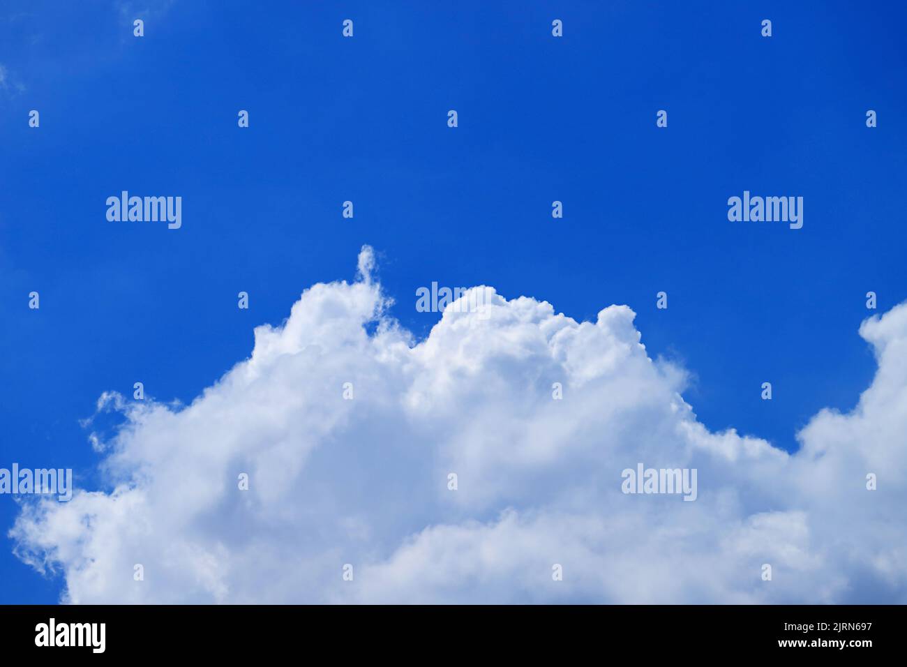 Pure White Cumulus Clouds on Vivid Blue Sunny Sky Stock Photo - Alamy