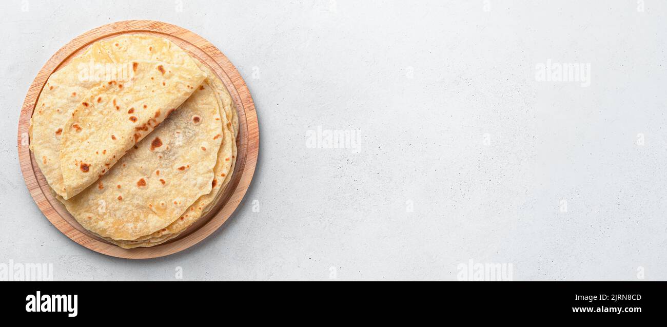 Fresh, Indian chapati cakes on a gray background. Top view, copy space. Stock Photo