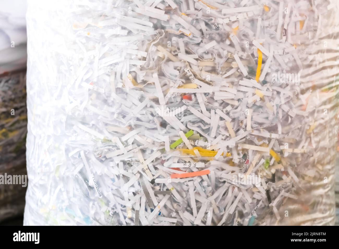 Shredded paper shreds in a bag, documents destroyed for privacy Stock