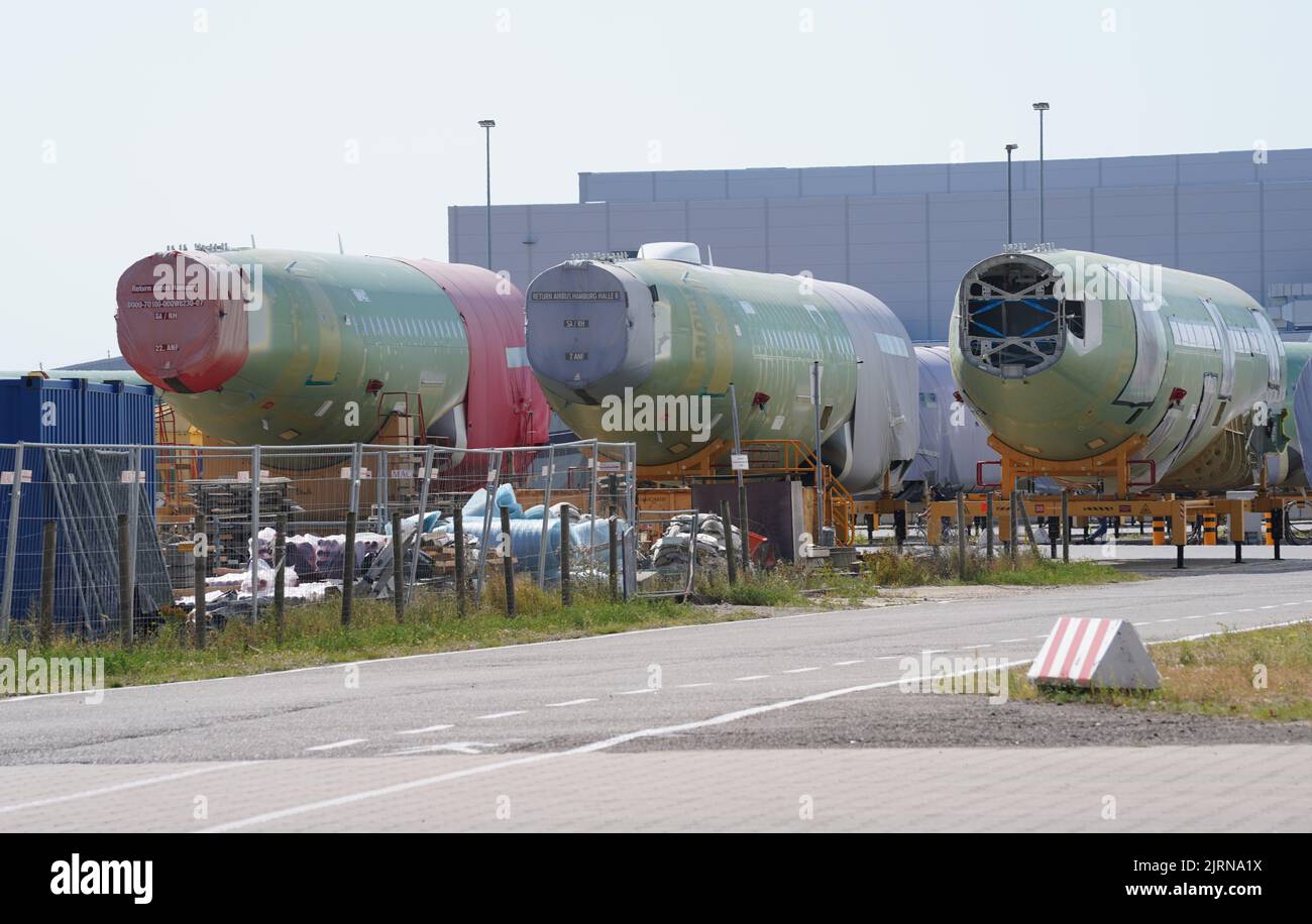 24 August 2022, Hamburg: Aircraft fuselages stand on the Airbus factory site in the Finkenwerder district of the city. The aircraft manufacturer Airbus is looking for more than 1,000 new employees for the planned ramp-up of production by mid-2023 alone. Photo: Marcus Brandt/dpa Stock Photo