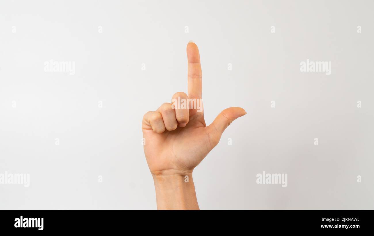 Sign language of the deaf and dumb people, English letter l Stock Photo