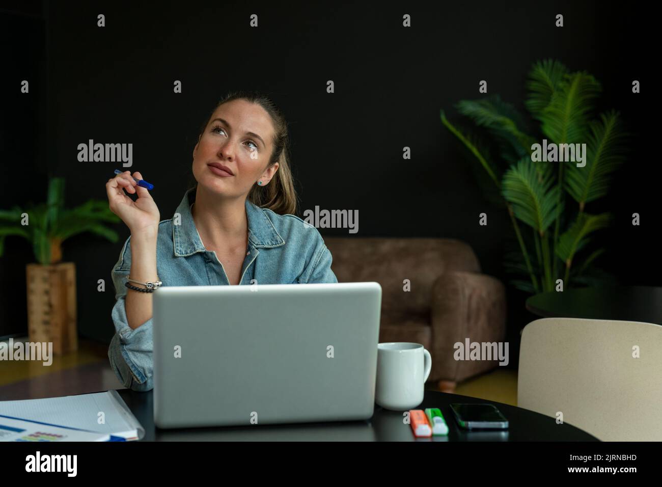 Girl working on laptop in trendy coffee shop - stock photo Stock Photo ...