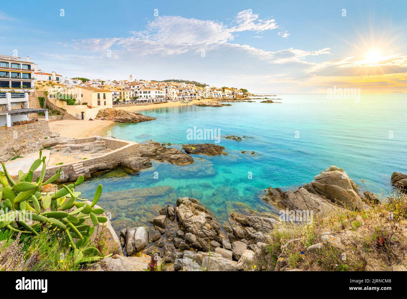The rocky coast, sandy beach and whitewashed fishing village of Calella de Palafrugell, Spain on the Costa Brava Spanish coast. Stock Photo