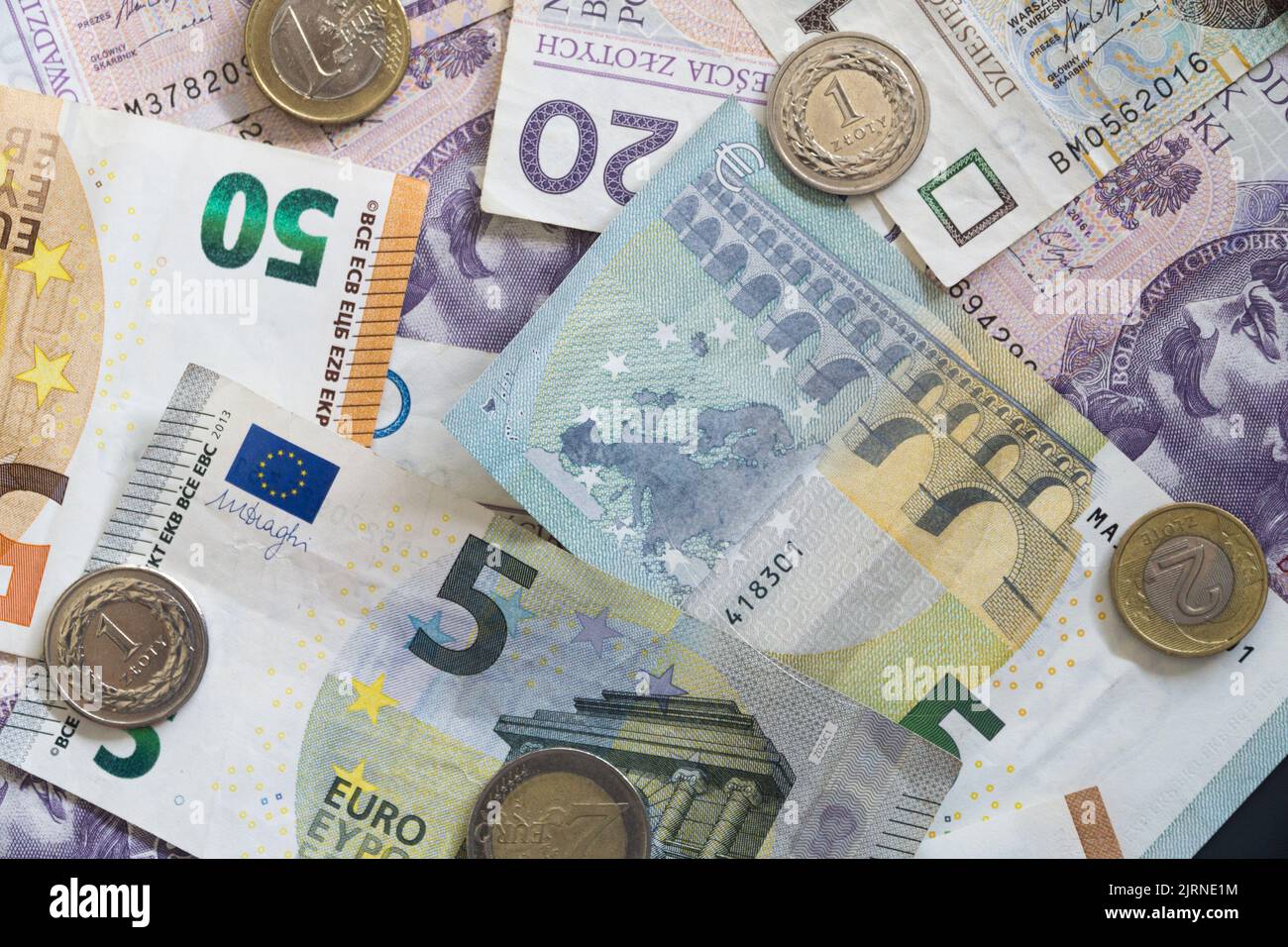 Collage from Euro money and Polish zloty. Polish and European coins and banknotes. Business and Financial concept. Stock Photo