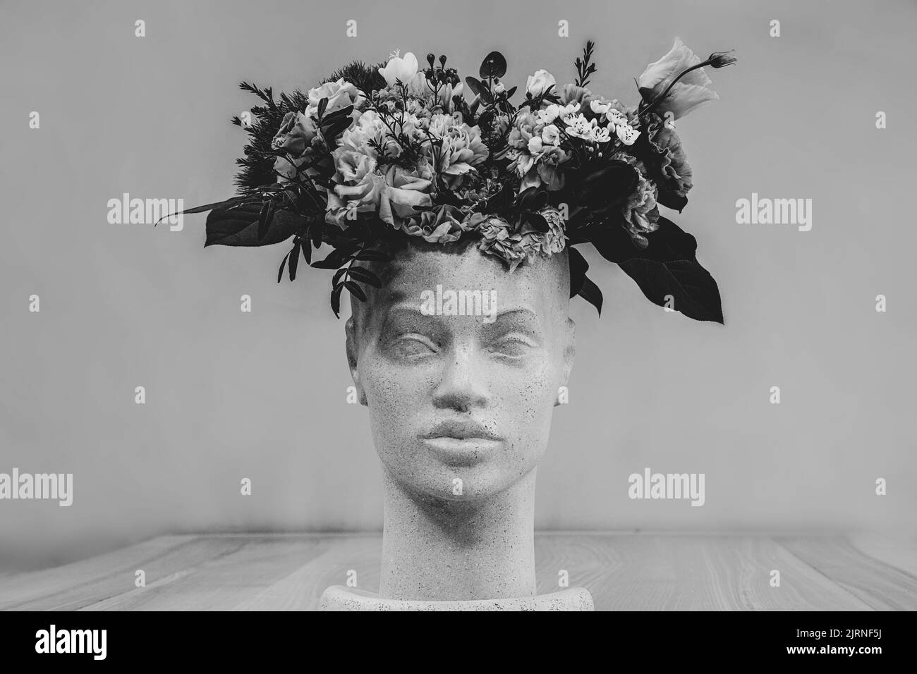 scissors for cutting flowers lie on a table with flowers in a flower