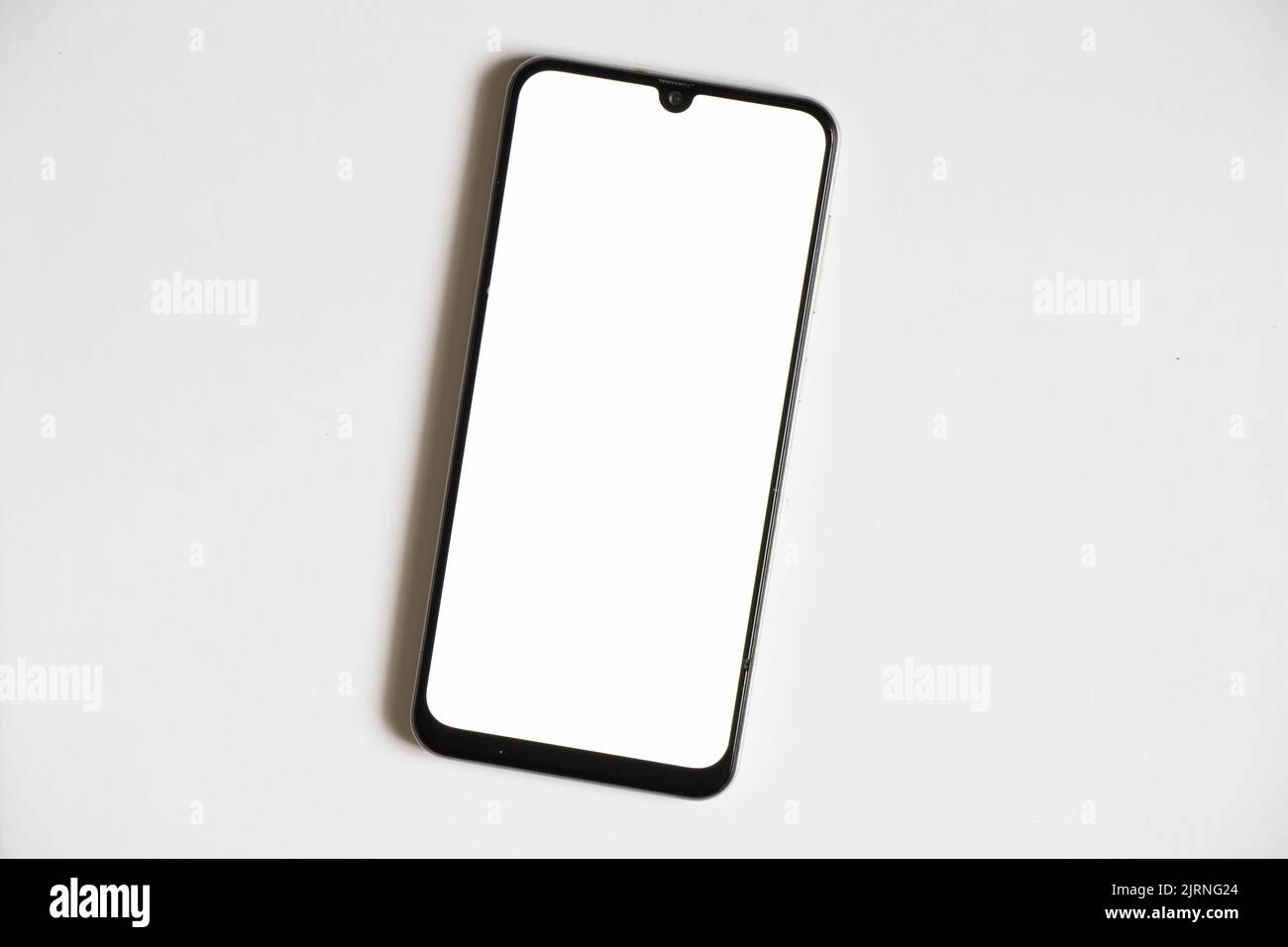 phone with white screen on isolated background, mobile phone, place for text template Stock