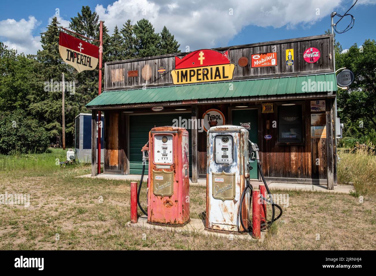 Abandoned vintage Imperial gas station on a summer day in Orrock