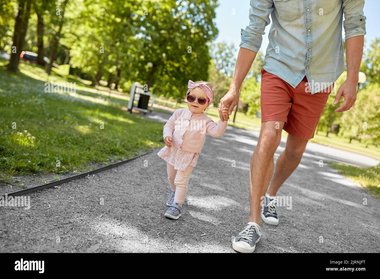 father with baby daughter walking at summer park Stock Photo - Alamy