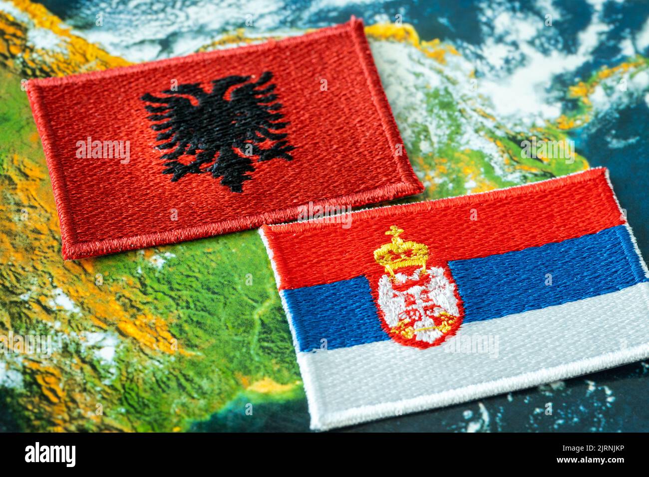 Flags of Albania and Serbia, Concept, Difficult relations between the two countries, Conflict over the Serb minority in Kosovo Stock Photo