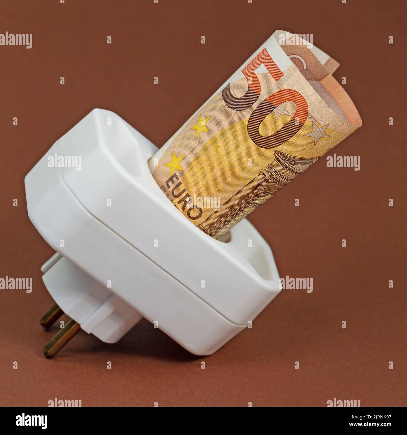 Socket and power plug with money bill Stock Photo Alamy