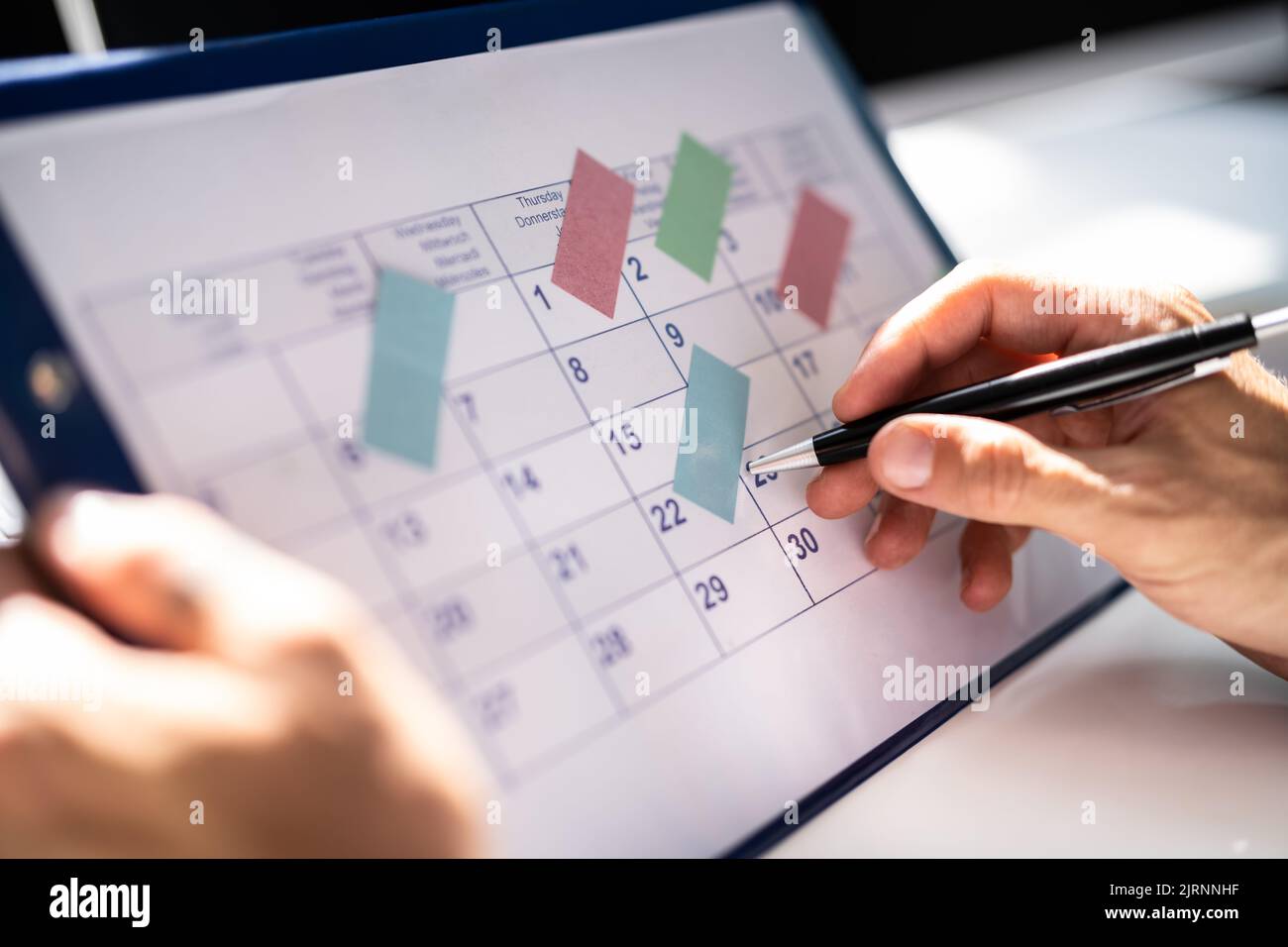 Event Schedule Calendar Planner. Checking Marketing Plan Stock Photo