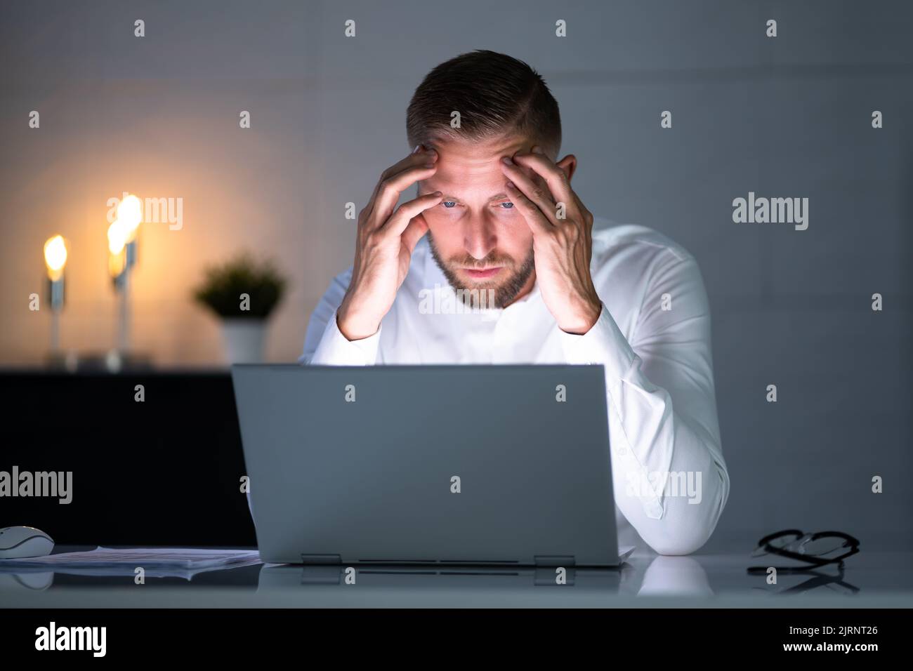 Stressed Depressed Man At Desk. Tired Bored Businessman Stock Photo