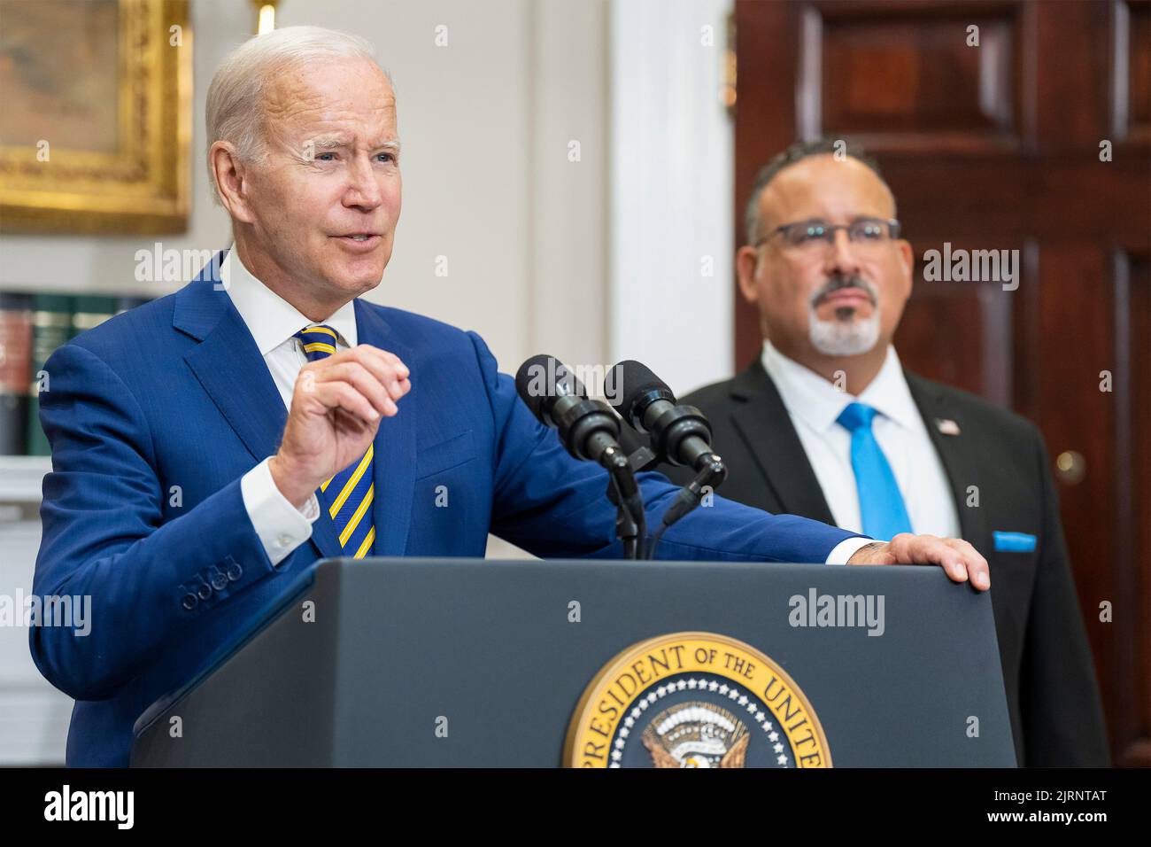 Washington, United States Of America. 24th Aug, 2022. Washington, United States of America. 24 August, 2022. U.S President Joe Biden, alongside Education Secretary Miguel Cardona, right, announces a plan on student loan debt forgiveness from the Roosevelt Room of the White House, August 24, 2022 in Washington, DC Credit: Adam Schultz/White House Photo/Alamy Live News Stock Photo