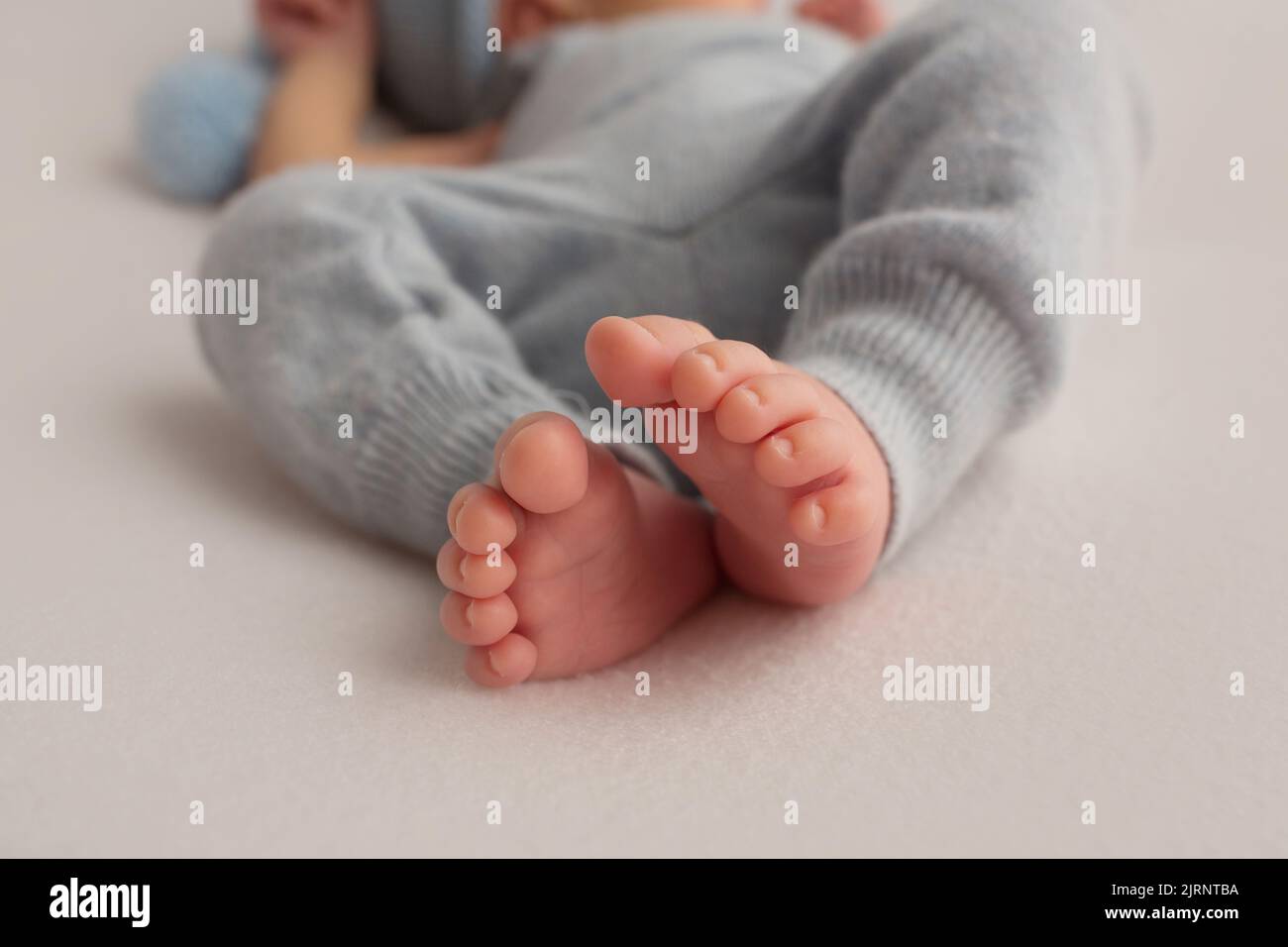 Newborn baby feet closeup. Pregnancy, preparation and expectation of