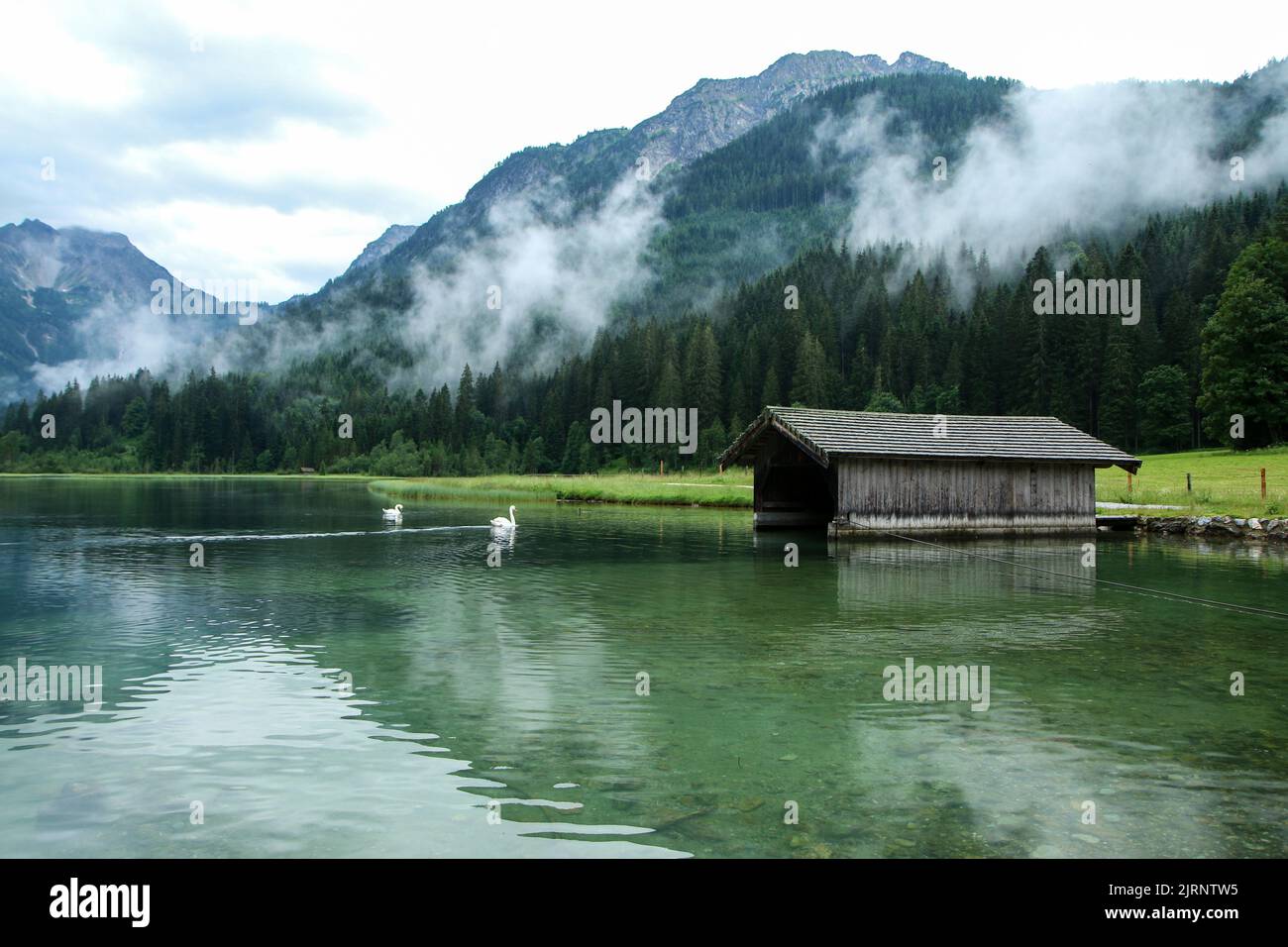 The glacier lake Jägersee in Austria in the Alps during the rainy and cloudy day. Travel destination for the tourists. Stock Photo