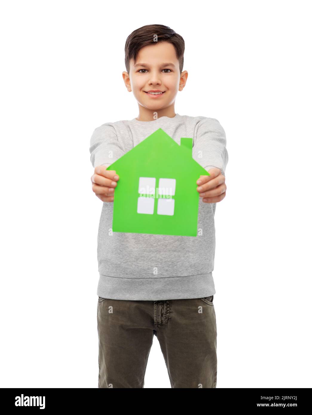 smiling boy holding green house icon Stock Photo - Alamy