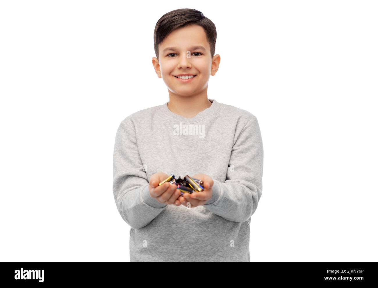 smiling boy holding pile of alkaline batteries Stock Photo - Alamy
