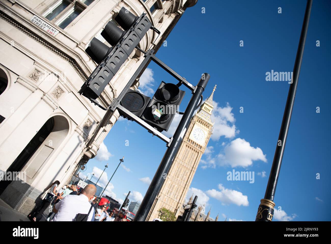 There is no pandemic, sticker on traffic light with Big Ben in the background Stock Photo