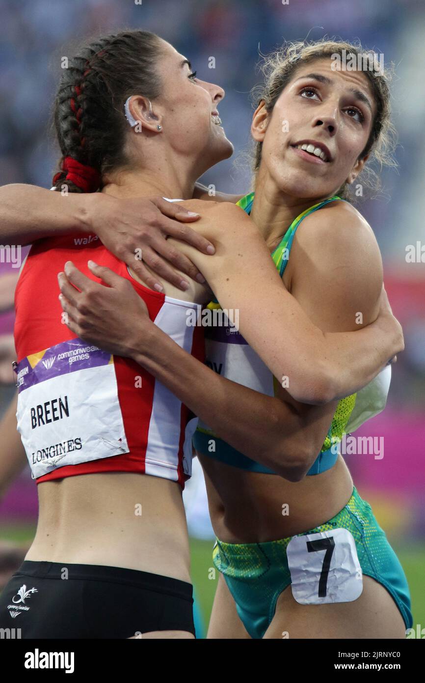 (L to R) Olivia BREEN of Wales celebrates winning gold with Ella PARDY of Australia in the Women's T37 / T38 100m - Final at the 2022 Commonwealth games in Birmingham. Stock Photo