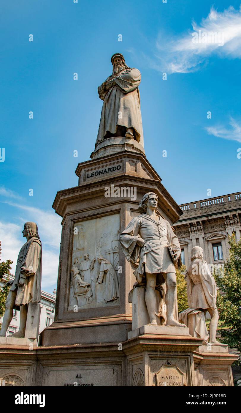 Statue of Leonardo da Vinci, marble and granite, depicting the Italian artist & inventor with four of his students, Piazza della Scala, Milan, Italy Stock Photo