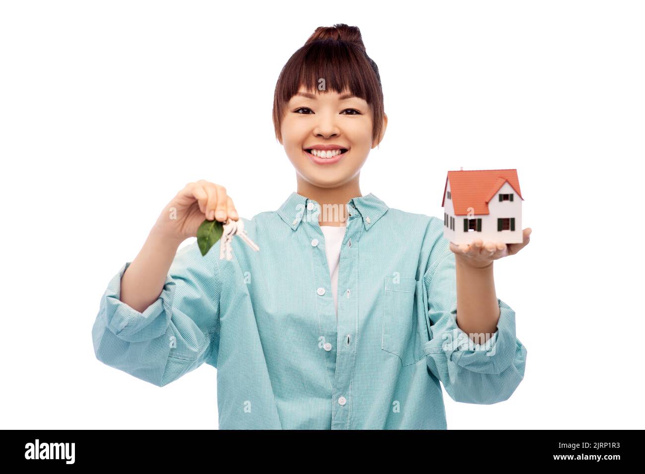 smiling asian woman holding house model and keys Stock Photo - Alamy