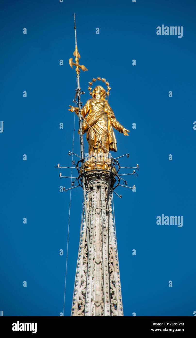 The Gold Madonna at the top of the Duomo Cathedral, Milan, Italy Stock Photo