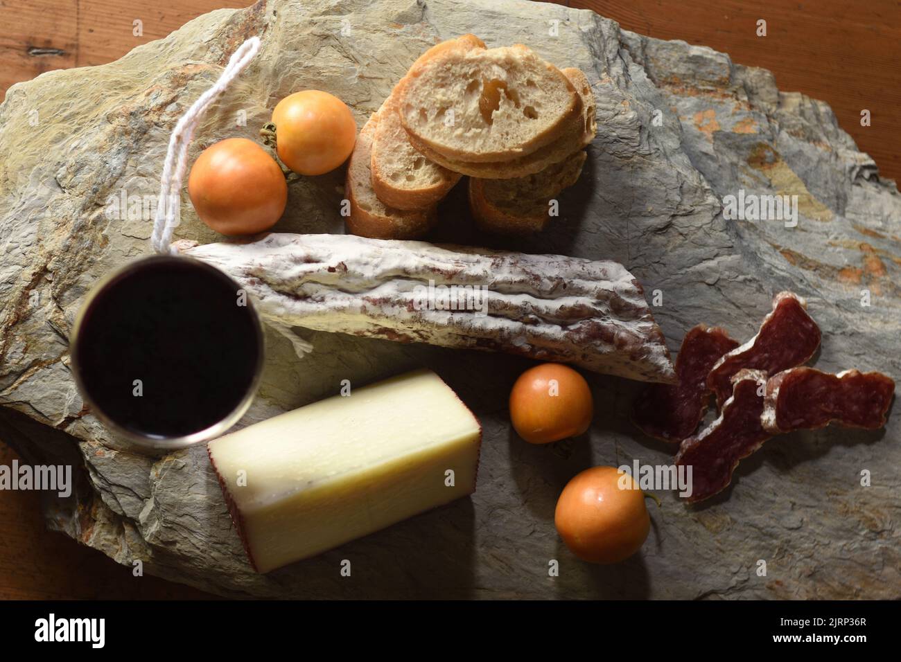 top view of typical spanish food,tomato,wine,bread, cheese and sausage