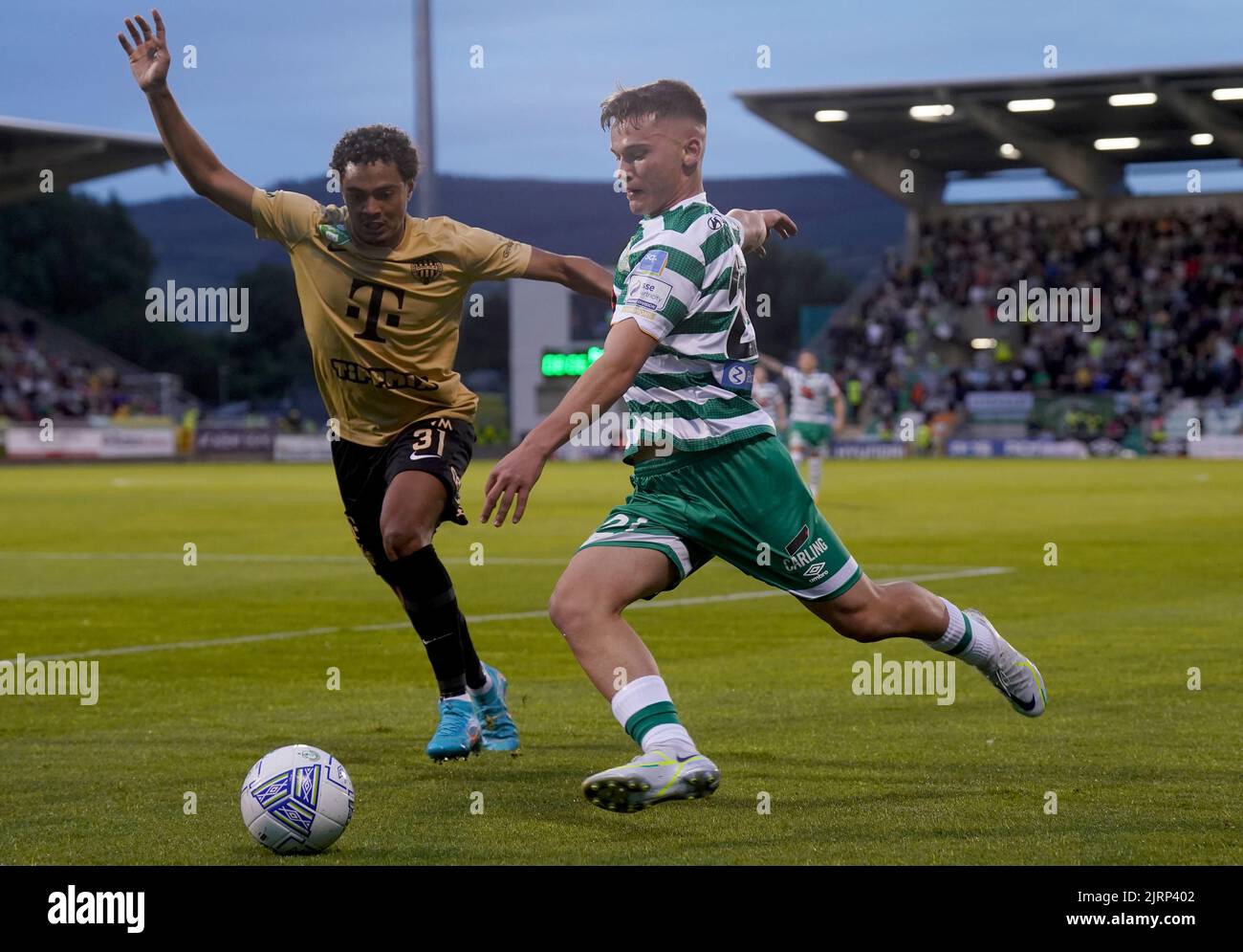 BUDAPEST, HUNGARY - JULY 13: Aleksa Amanovic of FC Tobol challenges  Kristoffer Zachariassen of Ferencvarosi TC during the UEFA Champions League  2022/23 First Qualifying Round Second Leg match between Ferencvarosi TC and