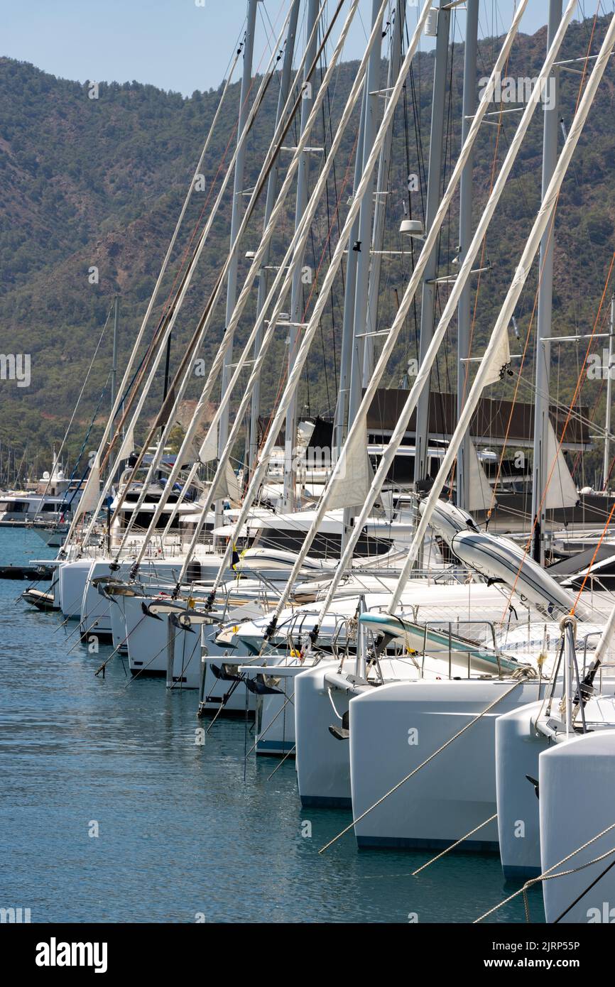 Catamaran sailboat and yachts in marina Stock Photo
