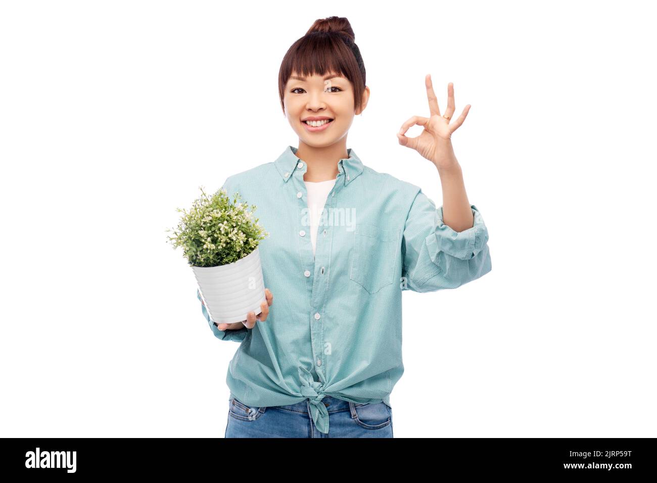 happy smiling asian woman holding flower in pot Stock Photo - Alamy
