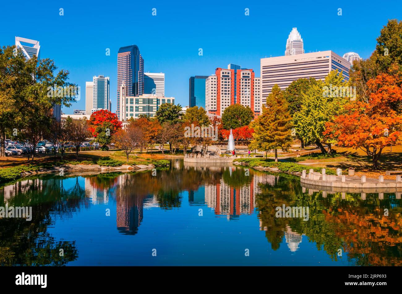 The colorful skyscrapers of Charlotte city shot from the autumn park ...