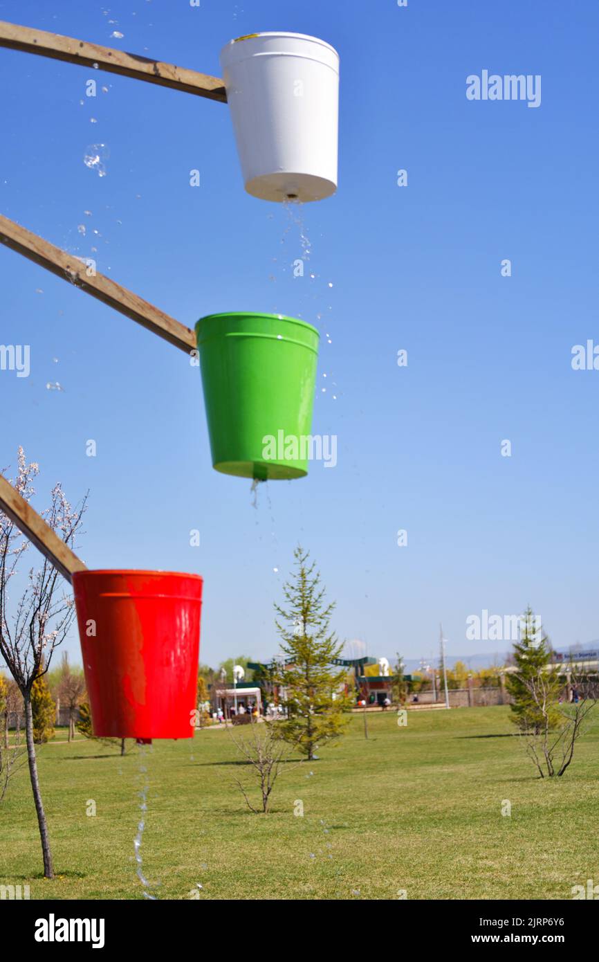 Colorful Buckets of watermill Stock Photo
