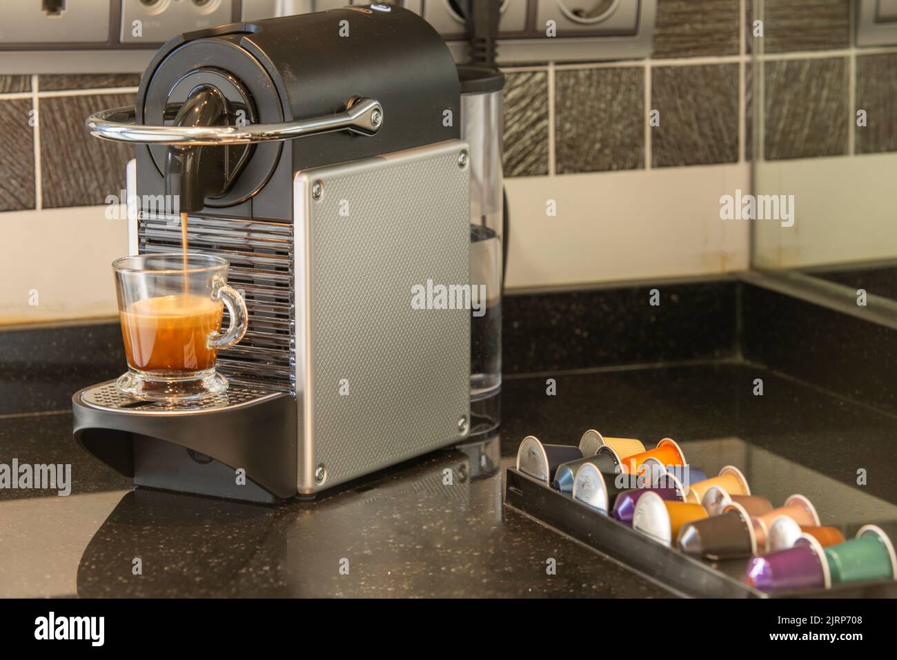 Automatic coffee machine coffee capsules or pods pouring espresso drink. Making coffee in a coffee machine. Brewing coffee Stock Photo Alamy