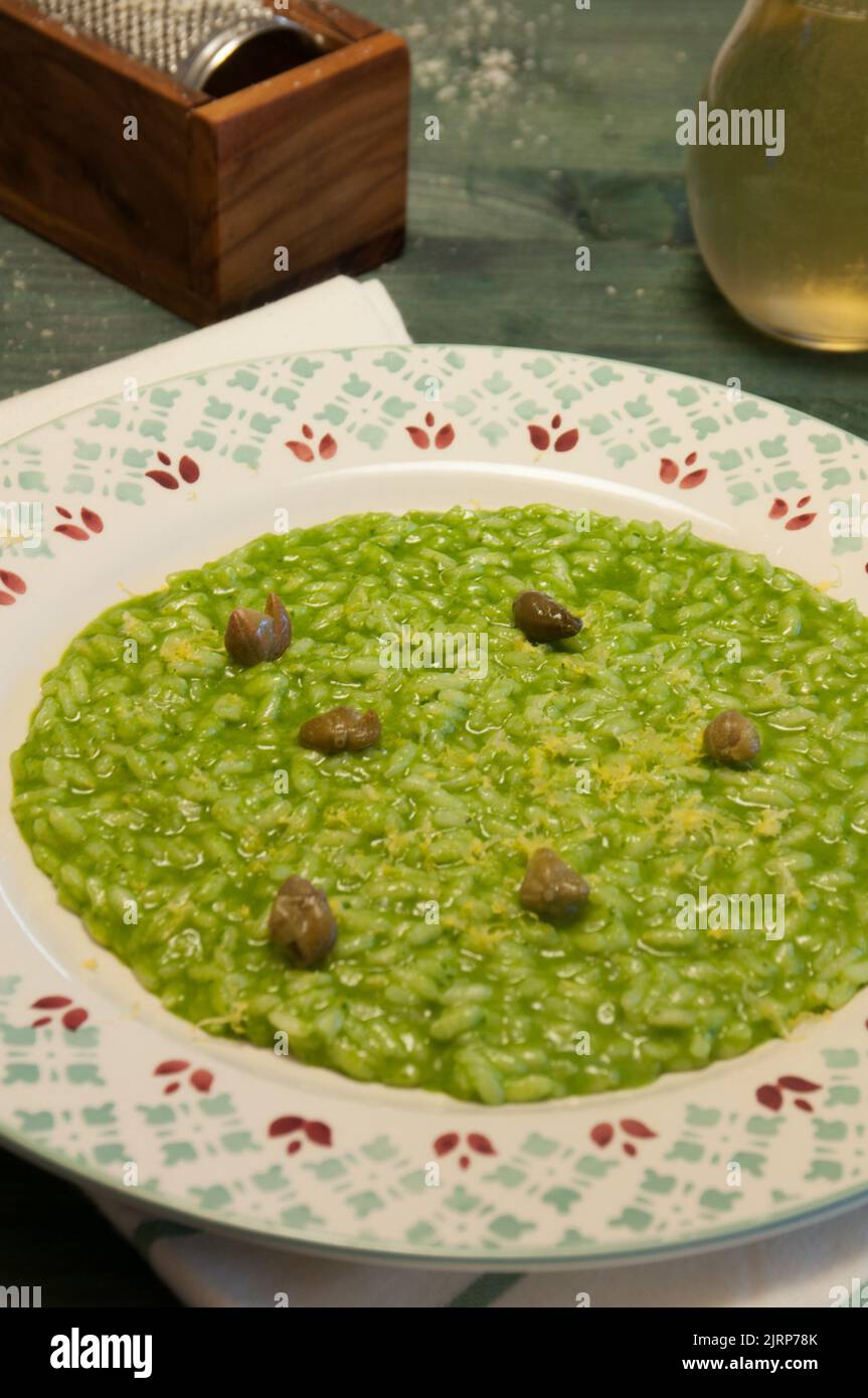 Delicious risotto with parsley, lemon and capers Stock Photo