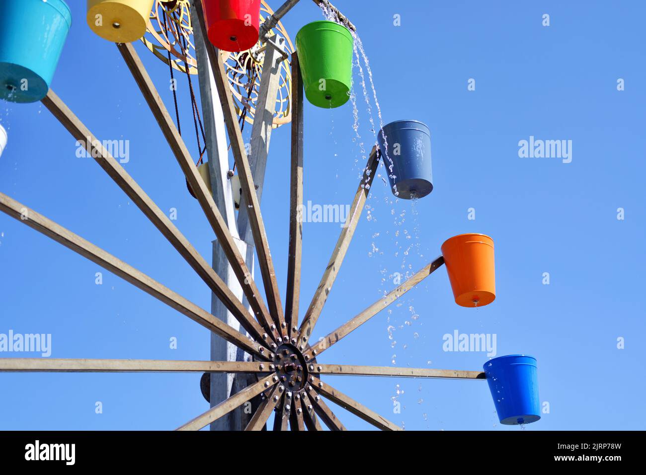 Colorful Buckets of watermill Stock Photo