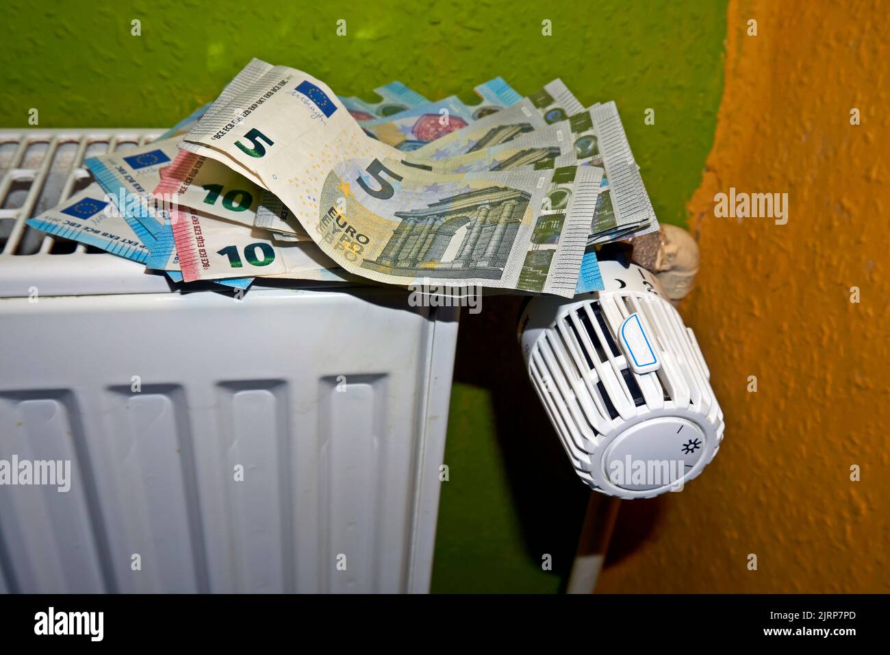Euro banknotes against the background of the radiator. Gas shortages in ...