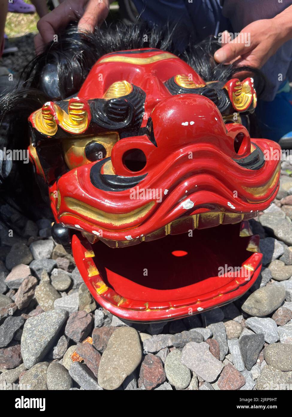 Red shishi lion head Japanese festival mask Stock Photo