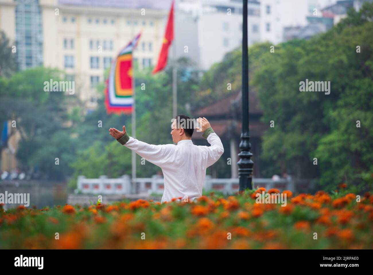 Hanoi City, Vietnam, April 24, 2017; Life in Hanoi. Sportsman exercising by Hoan Kiem Lake. Stock Photo