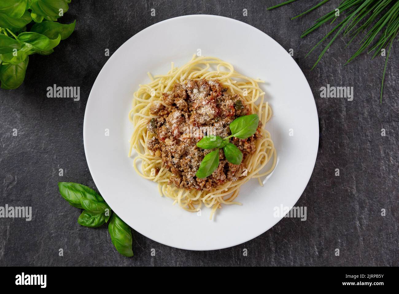 Traditional italian spaghetti bolognese with mince meat, tomato sauce, parmesan cheese, basil