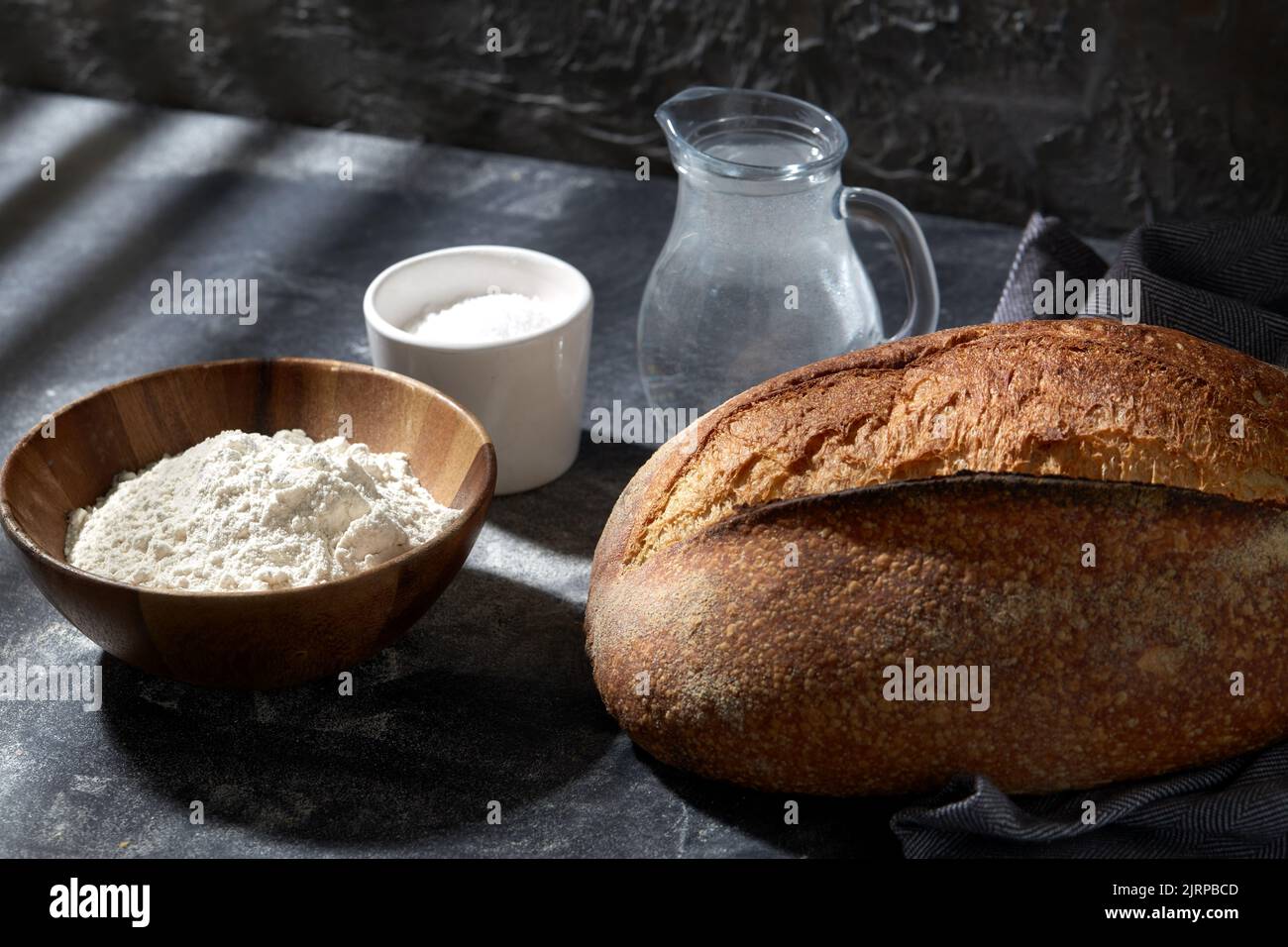 bread, wheat flour, salt and water in glass jug Stock Photo Alamy