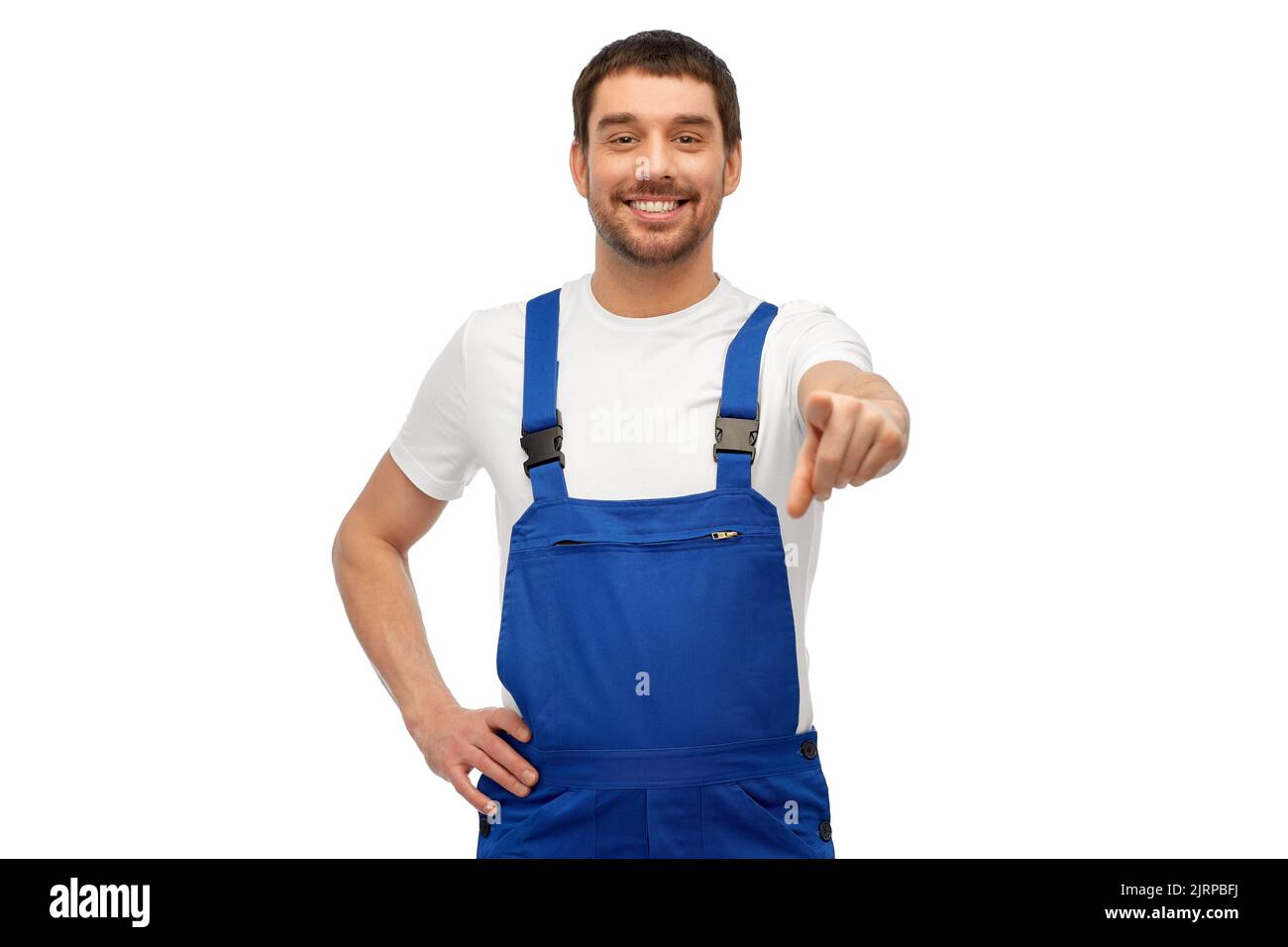happy male worker or builder pointing to camera Stock Photo