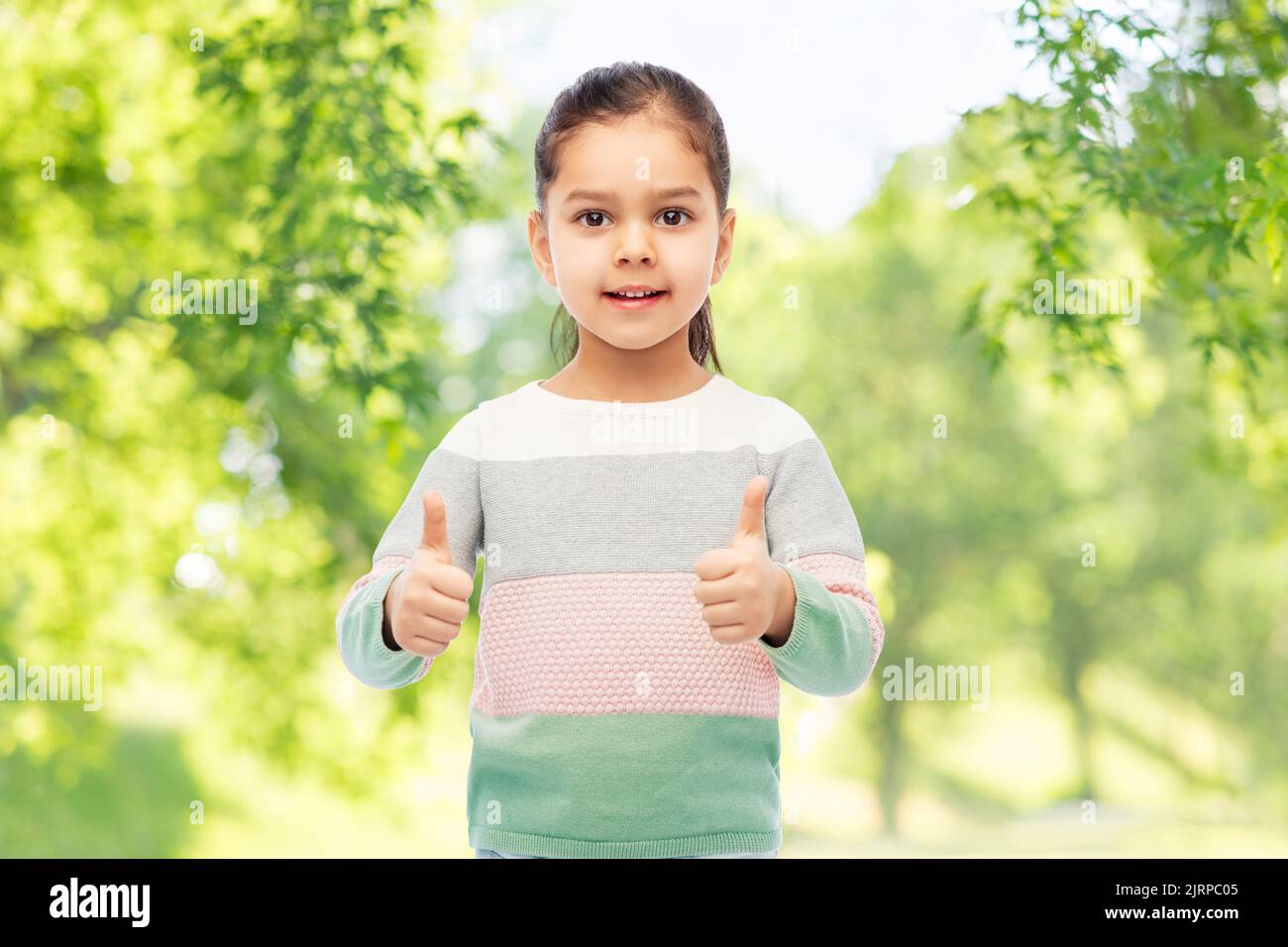 happy smiling girl showing thumbs up Stock Photo - Alamy