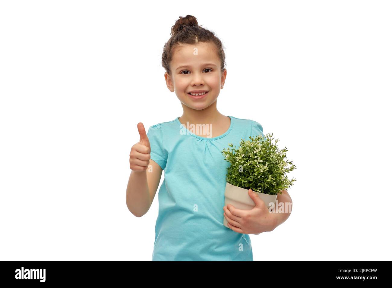 smiling girl holding flower and showing thumbs up Stock Photo - Alamy