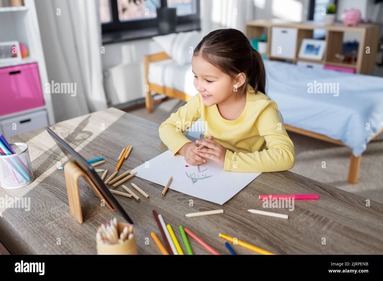 little girl drawing with coloring pencils at home Stock Photo - Alamy