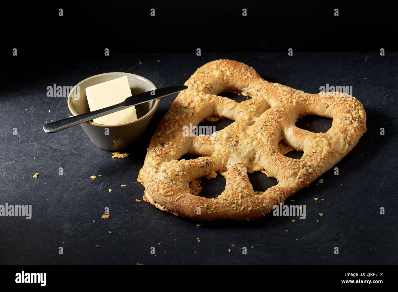 close up of cheese bread, butter and table knife Stock Photo - Alamy