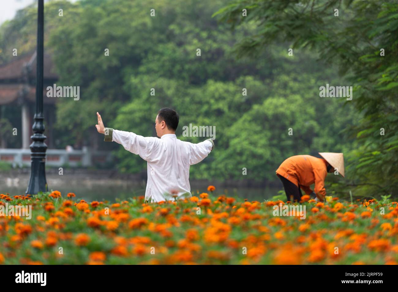 Hanoi City, Vietnam, April 24, 2017; Life in Hanoi. Sportsman exercising by Hoan Kiem Lake. Stock Photo
