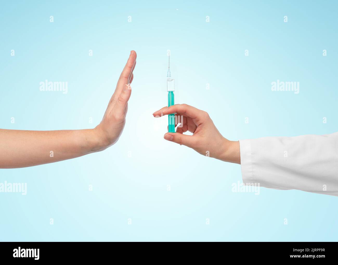 hand with syringe and showing stop gesture Stock Photo Alamy