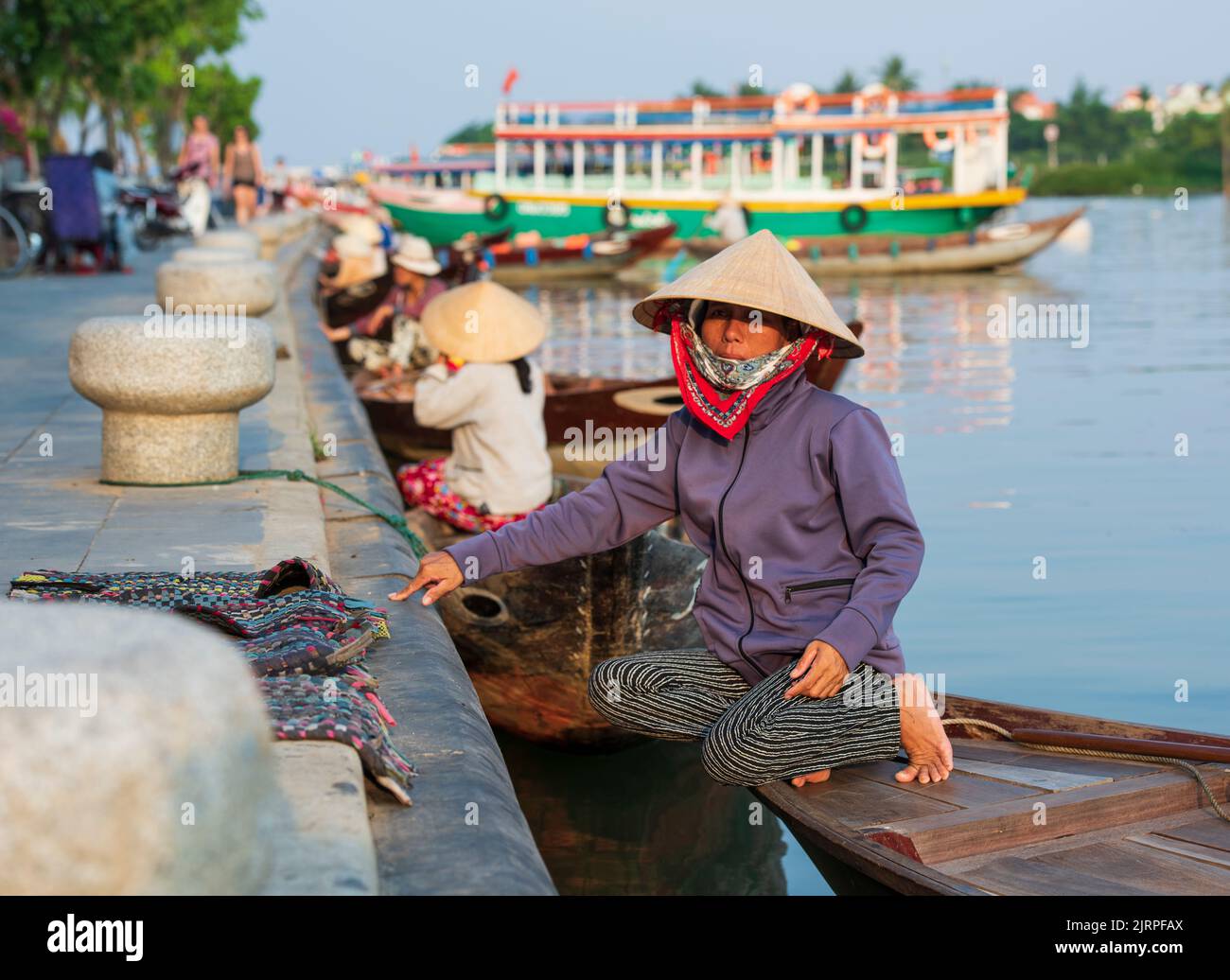 HOI AN, VIETNAM - APRIL 19, 2017: Sightseeing boats in Hoi An city. Vietnam a popular tourist destination of Asia. Hoi An is recognized as a World Her Stock Photo
