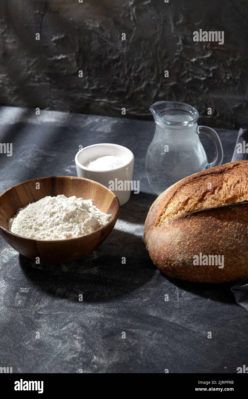 bread, wheat flour, salt and water in glass jug Stock Photo Alamy